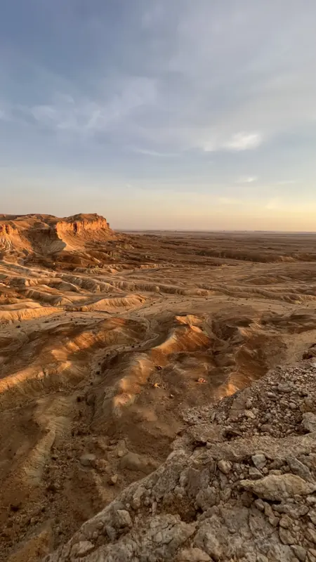 Layered sandstone canyon at a Thadiq geosite visited by the MGMT Home team